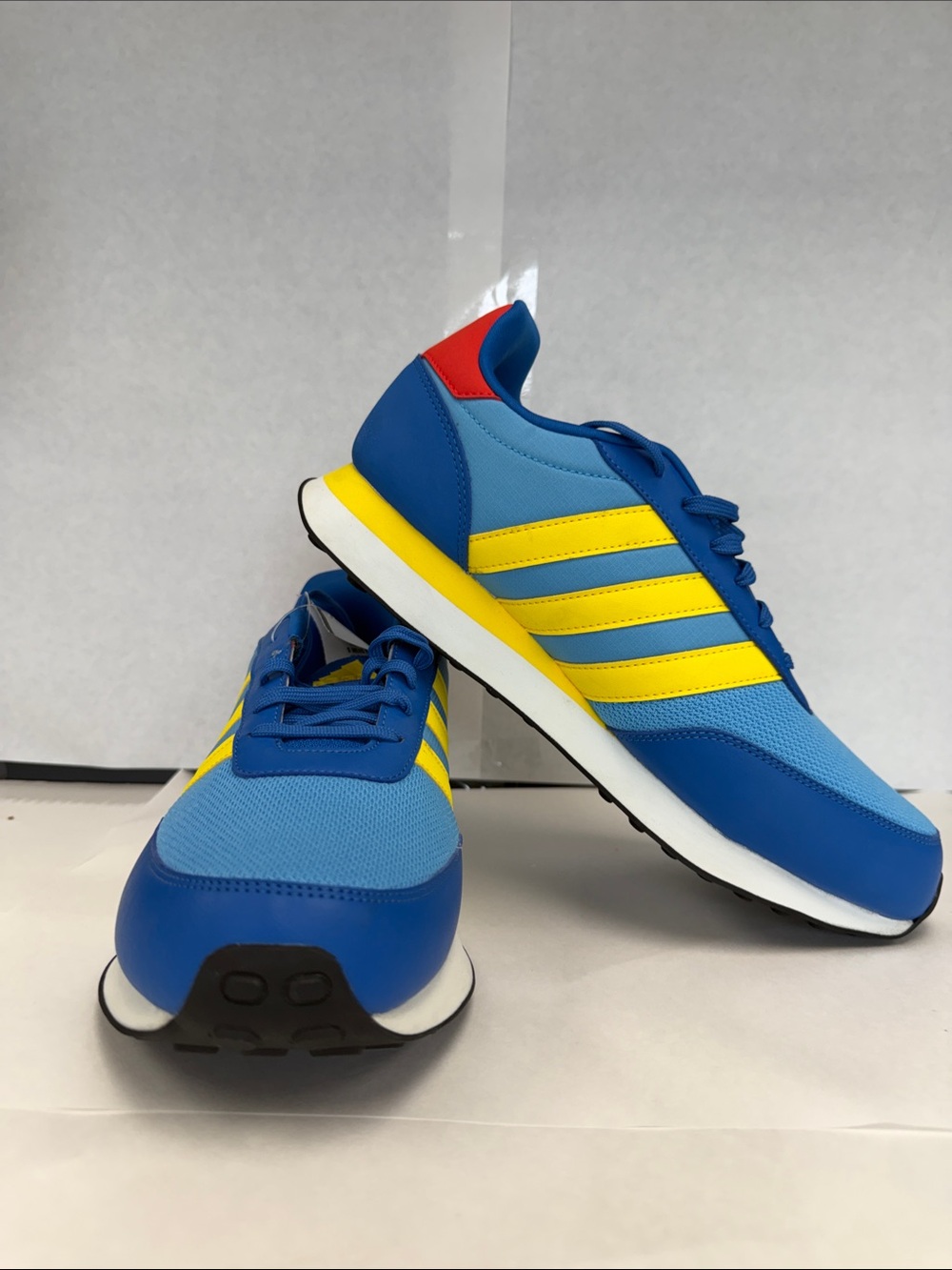 adidas Men's Blue Sneakers with Yellow Stripes and Red Heel Accent